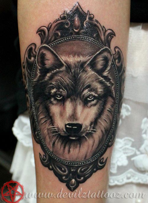 wolf portrait in frame tattoo design