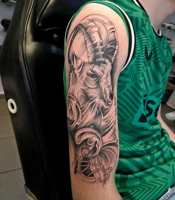 capricorn zodiac sign tattoo boy full bicep